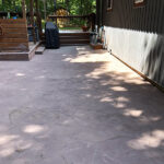 stamped concrete patio in backyard